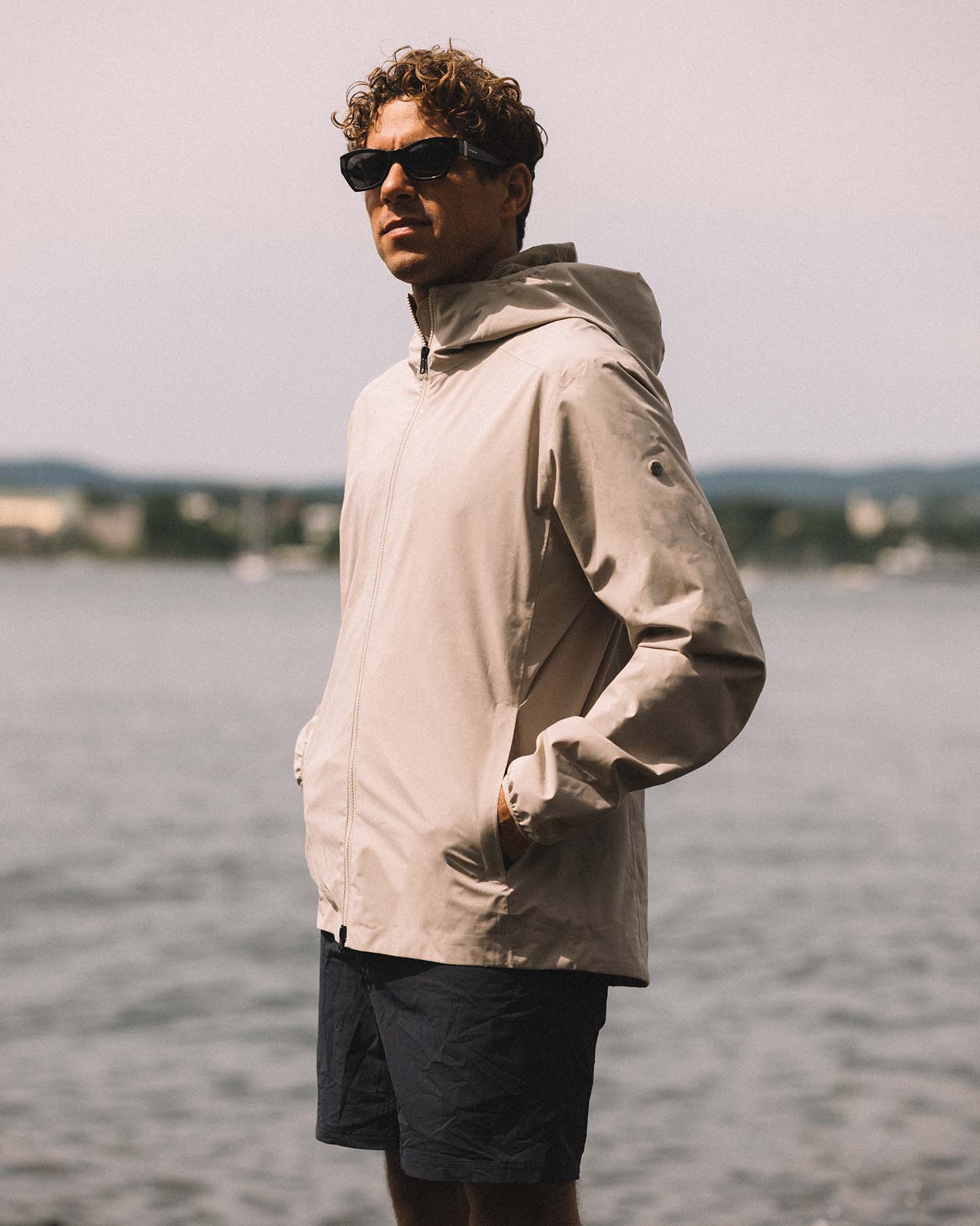 Beige hooded jacket on a light gray background