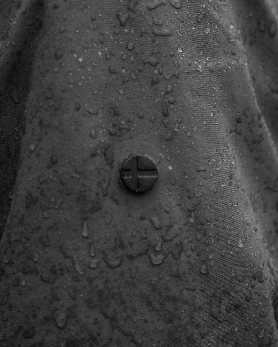 Close-up of the Scandinavian Edition badge on a wet jacket sleeve